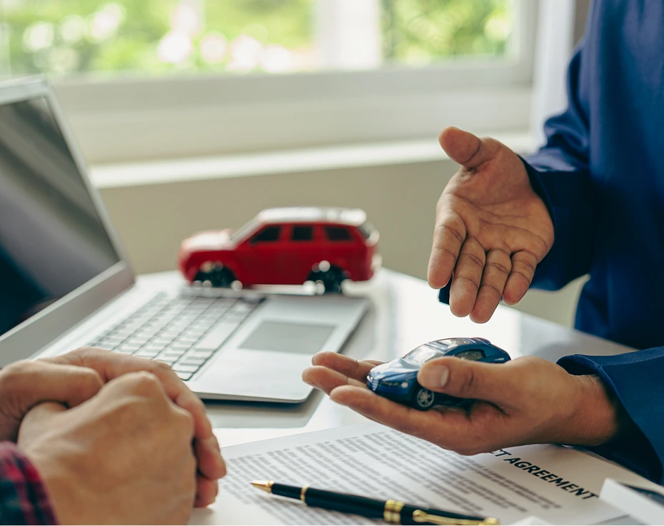 Car sale negotiation with miniature models